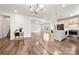Inviting open floorplan showcases a seamless flow between living, dining, and kitchen areas at 1268 Scotch Meadows Loop, Monroe, NC 28110
