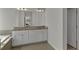 Bathroom featuring double vanity with granite countertop and white cabinets at 128 Stibbs Cross Rd, Mooresville, NC 28115