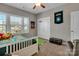 Bedroom featuring decor, a large window, plush carpet, and ample room for storage at 128 Stibbs Cross Rd, Mooresville, NC 28115