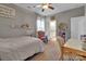 Bedroom with cozy chair, a desk, and ample natural light, offering a versatile space at 128 Stibbs Cross Rd, Mooresville, NC 28115