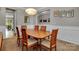 Spacious dining room featuring a large wooden table, seating for six, and elegant decor at 128 Stibbs Cross Rd, Mooresville, NC 28115