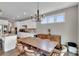 This dining room boasts a modern chandelier and view into the beautiful kitchen at 128 Stibbs Cross Rd, Mooresville, NC 28115