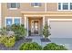 Inviting front porch featuring a cozy seating area and well-maintained landscaping at 128 Stibbs Cross Rd, Mooresville, NC 28115