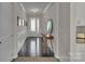 Elegant hallway with hardwood floors, decorative molding, and ample natural light at 128 Stibbs Cross Rd, Mooresville, NC 28115