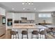 Well-appointed kitchen with a large island, bar seating, and modern appliances at 128 Stibbs Cross Rd, Mooresville, NC 28115