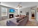 This beautifully decorated living room has a fireplace, comfortable seating, and natural light at 128 Stibbs Cross Rd, Mooresville, NC 28115