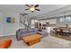 The open-concept living space showcases a comfortable sofa and views into the gourmet kitchen at 128 Stibbs Cross Rd, Mooresville, NC 28115