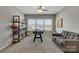 Recreation room featuring a foosball table, sofa, and built-in shelves at 128 Stibbs Cross Rd, Mooresville, NC 28115