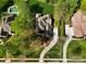 Aerial view of the property with a pool, large trees, landscaped yard, and a circular driveway at 13620 Castleford Dr, Mint Hill, NC 28227