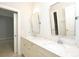 Bathroom boasts double sinks, quartz countertops, framed mirrors, and modern fixtures at 13620 Castleford Dr, Mint Hill, NC 28227
