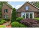 Charming brick home with mature landscaping and bay window at 13620 Castleford Dr, Mint Hill, NC 28227