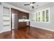 Kitchenette area with wooden cabinets, stainless steel appliances, and natural light at 13620 Castleford Dr, Mint Hill, NC 28227