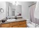 Functional bathroom with a single vanity, a mirror and a combined shower and bathtub at 1386 21St Ne Ave, Hickory, NC 28601