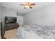 Bedroom featuring carpeted floors, ceiling fan, TV on a dresser and closet with mirrored doors at 1386 21St Ne Ave, Hickory, NC 28601