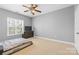 This bedroom offers natural light and a ceiling fan, creating a comfy, inviting atmosphere at 1386 21St Ne Ave, Hickory, NC 28601