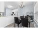 Dining area with classic chandelier lighting adjacent to an efficiently designed, modern kitchen space at 1386 21St Ne Ave, Hickory, NC 28601