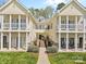 Inviting townhome with classic architecture, featuring bright yellow siding and a manicured lawn at 1386 21St Ne Ave, Hickory, NC 28601