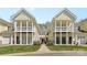 Charming townhome with yellow siding, white columns, and well-maintained landscaping at 1386 21St Ne Ave, Hickory, NC 28601