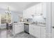Well-lit kitchen with stainless-steel appliances, white cabinets, and a view into the adjacent dining area at 1386 21St Ne Ave, Hickory, NC 28601