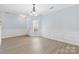 Bright living room featuring elegant chandelier, chair rail, and neutral flooring at 1386 21St Ne Ave, Hickory, NC 28601