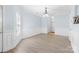 Bright living room featuring gray floors, elegant wainscoting, and a classic chandelier at 1386 21St Ne Ave, Hickory, NC 28601