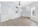 Spacious living room with light gray flooring, wainscoting details, and a decorative niche at 1386 21St Ne Ave, Hickory, NC 28601