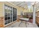 Charming outdoor space featuring a patio with a pergola, brick detailing, and a view of the surrounding landscape at 1386 21St Ne Ave, Hickory, NC 28601