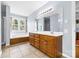 Bathroom with double vanity, tile floors, soaking tub and natural light at 139 Meadow Oaks Dr, Statesville, NC 28625