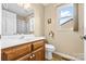 Practical bathroom with a tiled floor, vanity with storage, toilet and shower at 139 Meadow Oaks Dr, Statesville, NC 28625