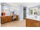 Bright bathroom featuring a vanity with dual sinks, a makeup station, and a glass-enclosed shower at 139 Meadow Oaks Dr, Statesville, NC 28625