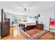 Serene bedroom showcasing a bed, wood floors, natural light, and an accent rug at 139 Meadow Oaks Dr, Statesville, NC 28625