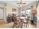Dining area featuring natural light from the window, a ceiling fan, and wooden table with chairs at 139 Meadow Oaks Dr, Statesville, NC 28625