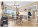 Dining area with ceiling fan, large windows, and a round wooden table with four chairs at 139 Meadow Oaks Dr, Statesville, NC 28625
