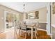 Charming dining area with hardwood floors and sliding door access to outdoor patio at 139 Meadow Oaks Dr, Statesville, NC 28625