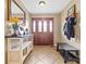 Foyer area with wooden floors, a wooden front door, and decorative furniture at 139 Meadow Oaks Dr, Statesville, NC 28625