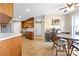 Spacious kitchen with light countertops, wooden cabinetry, and open dining area at 139 Meadow Oaks Dr, Statesville, NC 28625