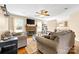 Bright living room featuring a fireplace, hardwood floors, and natural light at 139 Meadow Oaks Dr, Statesville, NC 28625