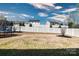 Trampoline in a fenced backyard with sparse landscaping and a view of surrounding homes at 1495 Imperial Ct, York, SC 29745