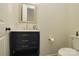 Elegant powder room featuring a dark vanity with gold hardware and a white marble countertop at 1495 Imperial Ct, York, SC 29745