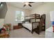 Cozy bedroom with bunk beds, carpet flooring, and a window offering natural light at 1495 Imperial Ct, York, SC 29745