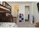 Bedroom with bunk beds, carpet flooring, and a storage shelf for books at 1495 Imperial Ct, York, SC 29745