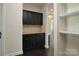 Butler's pantry with granite countertop and dark wood cabinets at 1495 Imperial Ct, York, SC 29745