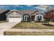 Charming single-story home featuring stone accents, a two-car garage, and a well-maintained front yard at 1495 Imperial Ct, York, SC 29745