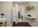 Hallway with hardwood floors, white trim, and neutral colored walls at 1495 Imperial Ct, York, SC 29745