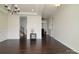 Elegant living room featuring dark hardwood floors, wainscotting and access to staircase and hallways at 1495 Imperial Ct, York, SC 29745