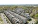 Aerial view of contemporary townhouses featuring rooftop terraces and tree-lined streets at 1617 Cannon View Ln, Charlotte, NC 28208