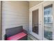Charming balcony space, with wicker bench and views of neighborhood, great for outdoor living at 1617 Cannon View Ln, Charlotte, NC 28208