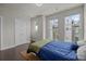 A well-lit bedroom includes hardwood floors and ample natural light, providing a relaxing and serene space at 1617 Cannon View Ln, Charlotte, NC 28208