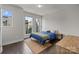 This bedroom features hardwood floors, natural light, and neutral walls, creating a cozy and inviting atmosphere at 1617 Cannon View Ln, Charlotte, NC 28208