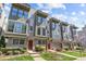 Modern townhome exterior with large windows, stylish trim, and well-maintained landscaping on a sunny day at 1617 Cannon View Ln, Charlotte, NC 28208
